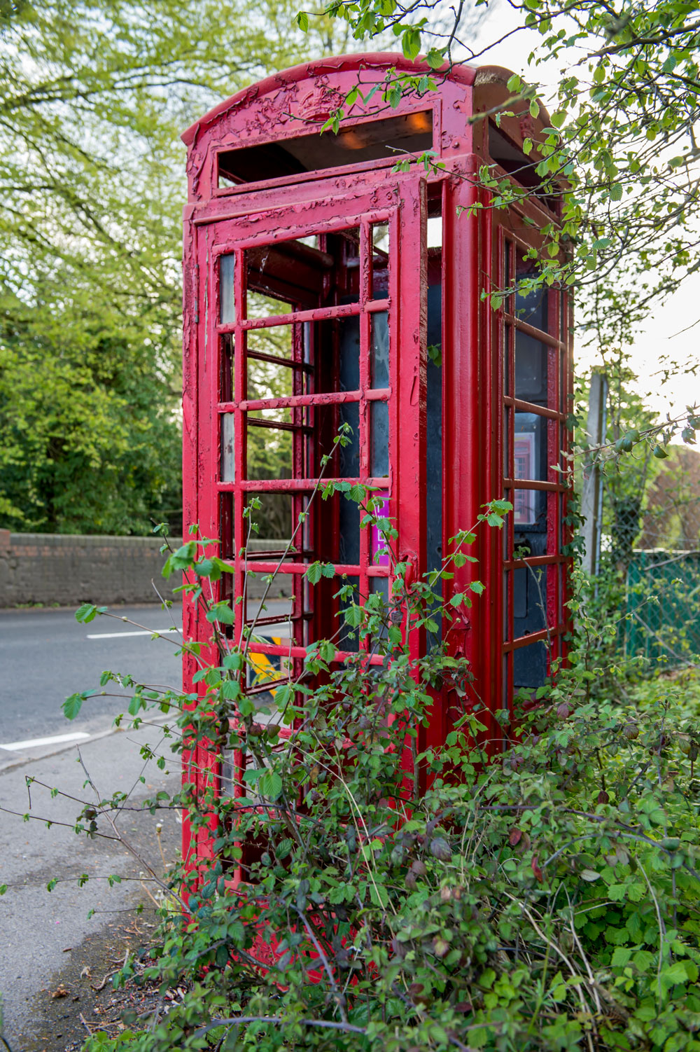 Redundant telephone box on the corner of Chopping Knife Lane - 'the lights are on but nobody's in' (unless you are a weed)