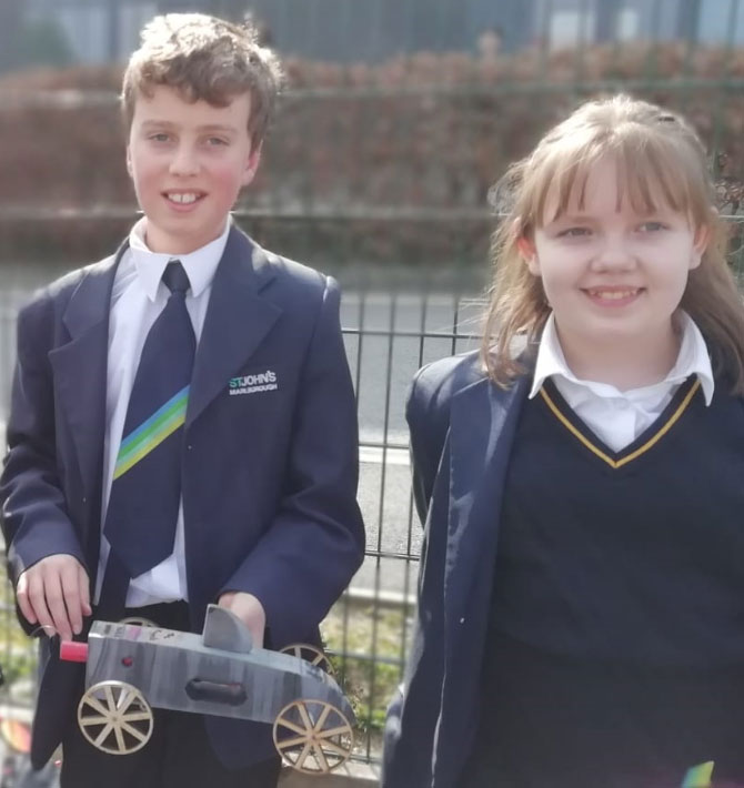 Two members of the winning Year7 team with their rocket car
