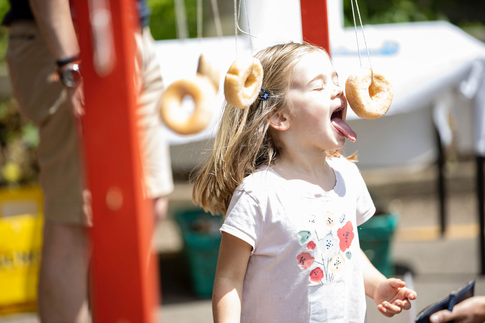 Fun and games with doughnuts at Chilton Foliat School fete credit Duncan Maclachlan