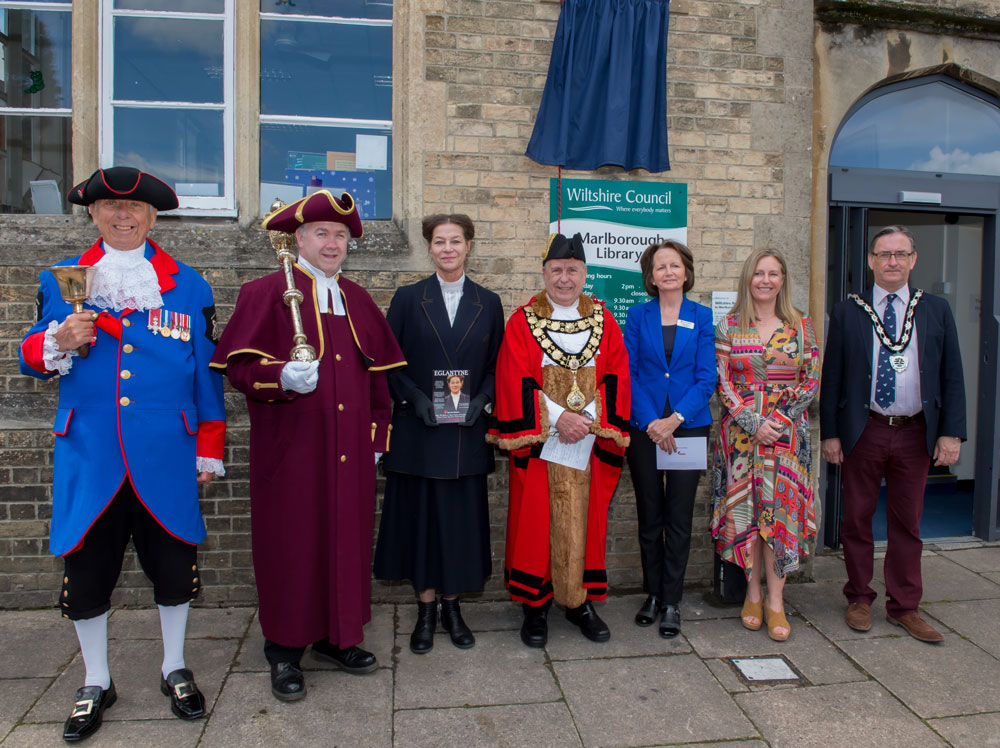 Unveiling of the new Blue Plaque for Eglantyne Jebb attended by (l-r) Town Crier, - Mike Tupman, Mace Bearer Bob Dobie, Anne Chamberlain (Eglantyne), Mayor Cllr Mervyn Hall, Fidelma Meehan (Save the Children), Wiltshire Councillor Jane Davies and Cllr James Sheppard, Chairman of Wiltshire Council