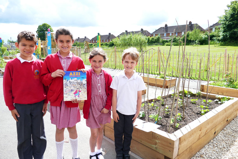 Marlborough St Mary's pupils with the graphic novel Azzi in Between and the runner beans they are growing