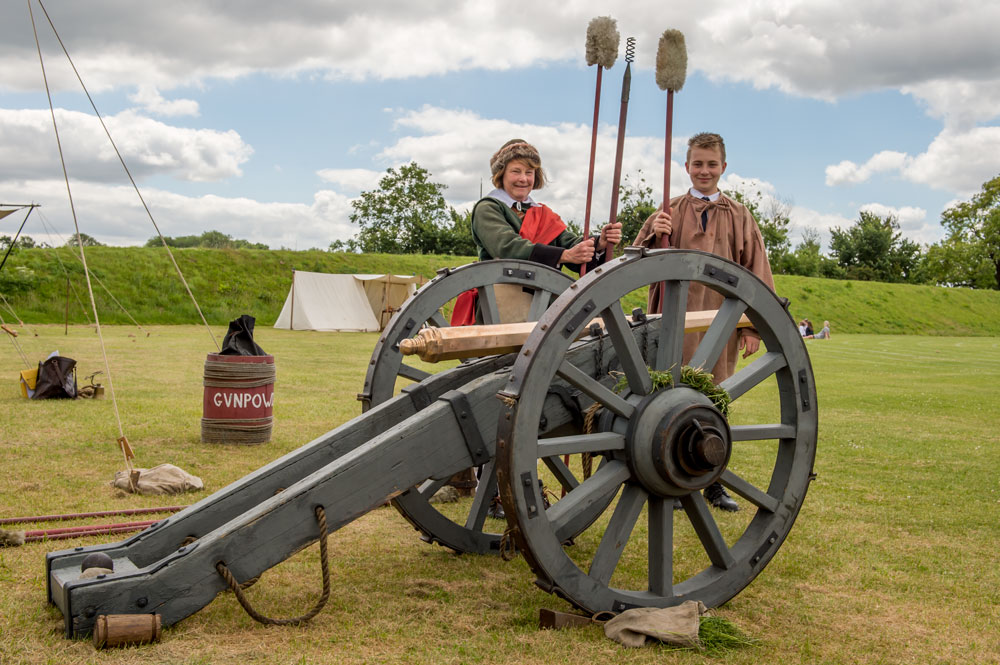 Mary MacDonald Watson from the English Civil War Society shows year 8 student Scott Granger how to load and fire a cannon