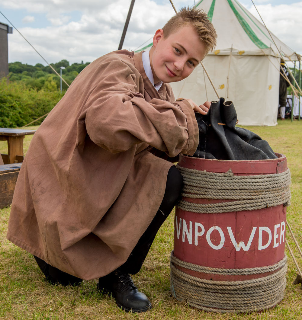 Year 8 student Scott Granger examining a keg of Gunpowder