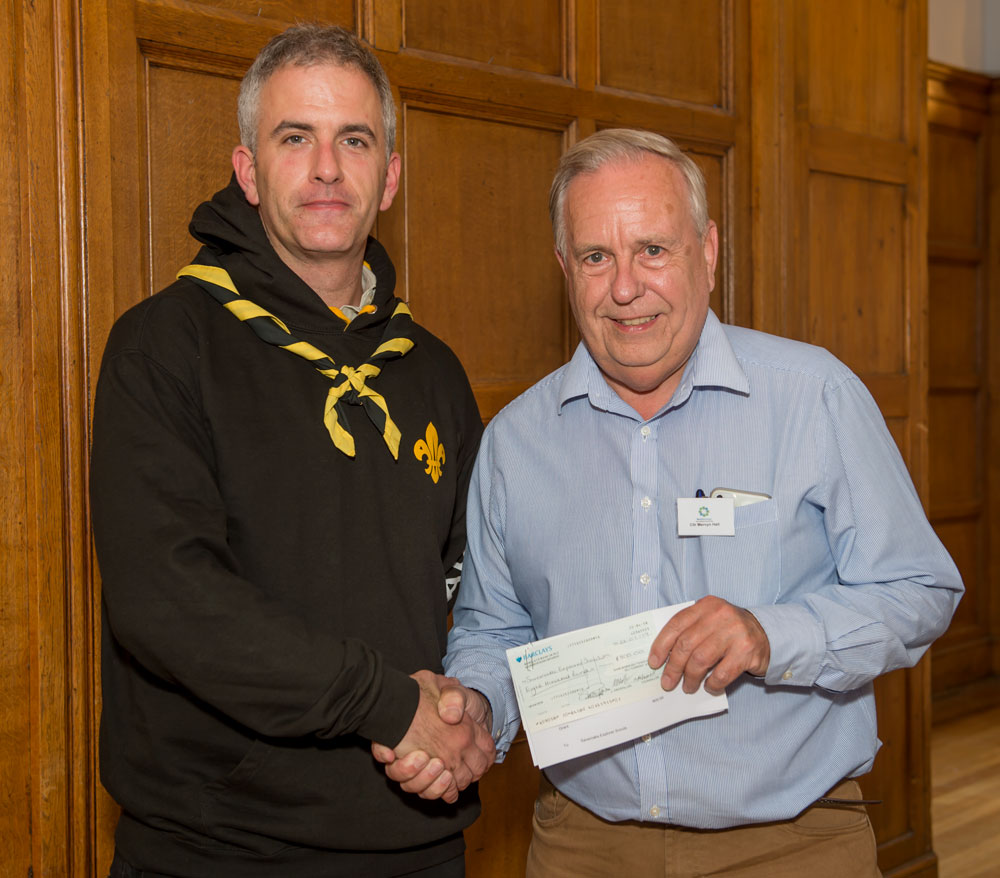 Scout Leader Peter Wilkinson receives the award cheque from Mayor Cllr Mervyn Hall