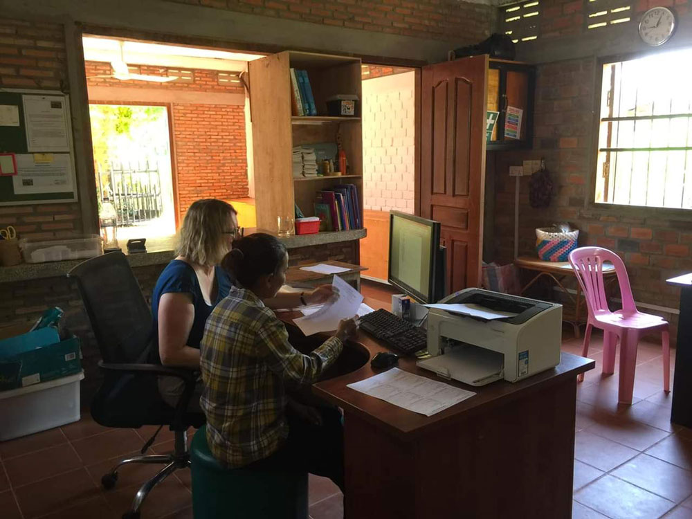 Kate working in the school office with Mealea the new admin assistant