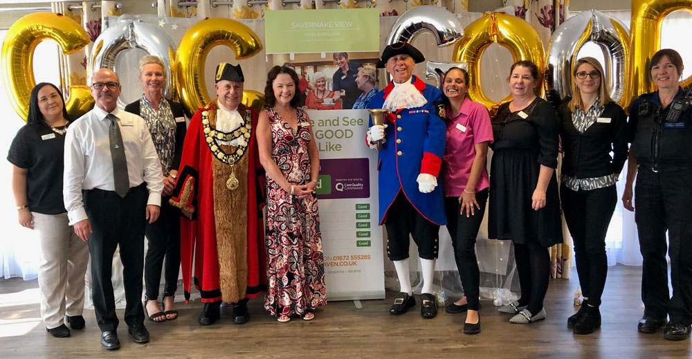 Mayor Mervyn Hall and Town Crier Mike Tupman with Savernake View manager Cathjy Fountain (centre) and staff