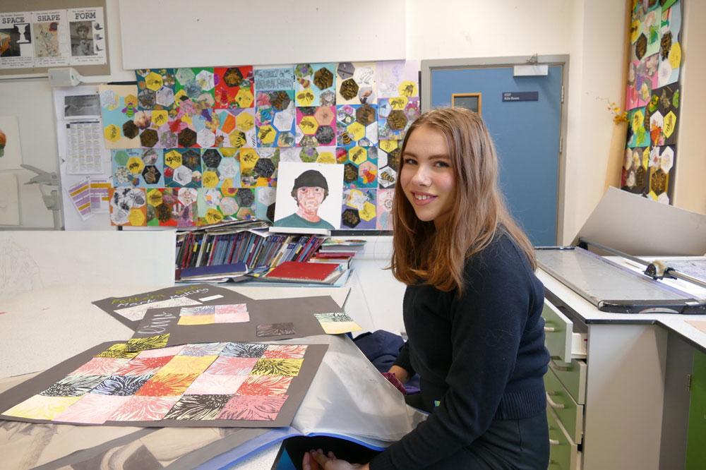 Prize winning art student Francesca Hutton with her GCSE Art work