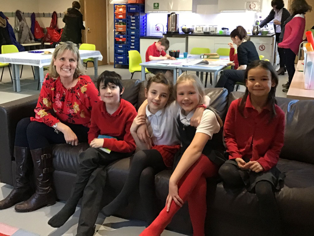 Sam Wolcough chair of governors at Chilton Foliat Primary School and trustee of Chilton Foliat Community Association with children from Chilton Foliat Primary School
