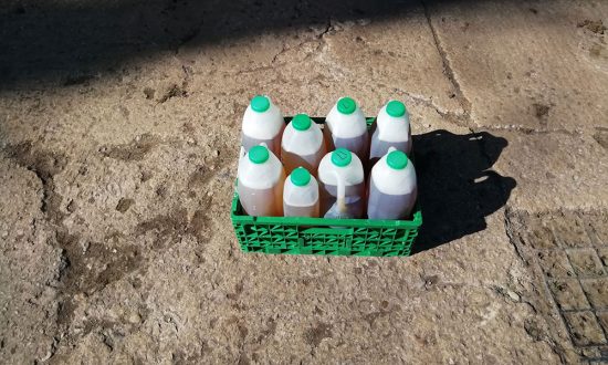 Waitrose beer donation in Waitrose milk bottles and crate