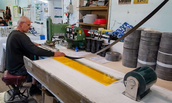 dobie wyatt - Stage 1 of the mask production process at Dobie Wyatt in Cadley - Graham Dobie at the heat sealing machine