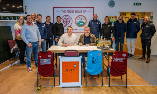 MTFC Chair Jamie Hughes and MYFC Chair Stuart Slater sign the agreement to confirm the coming together